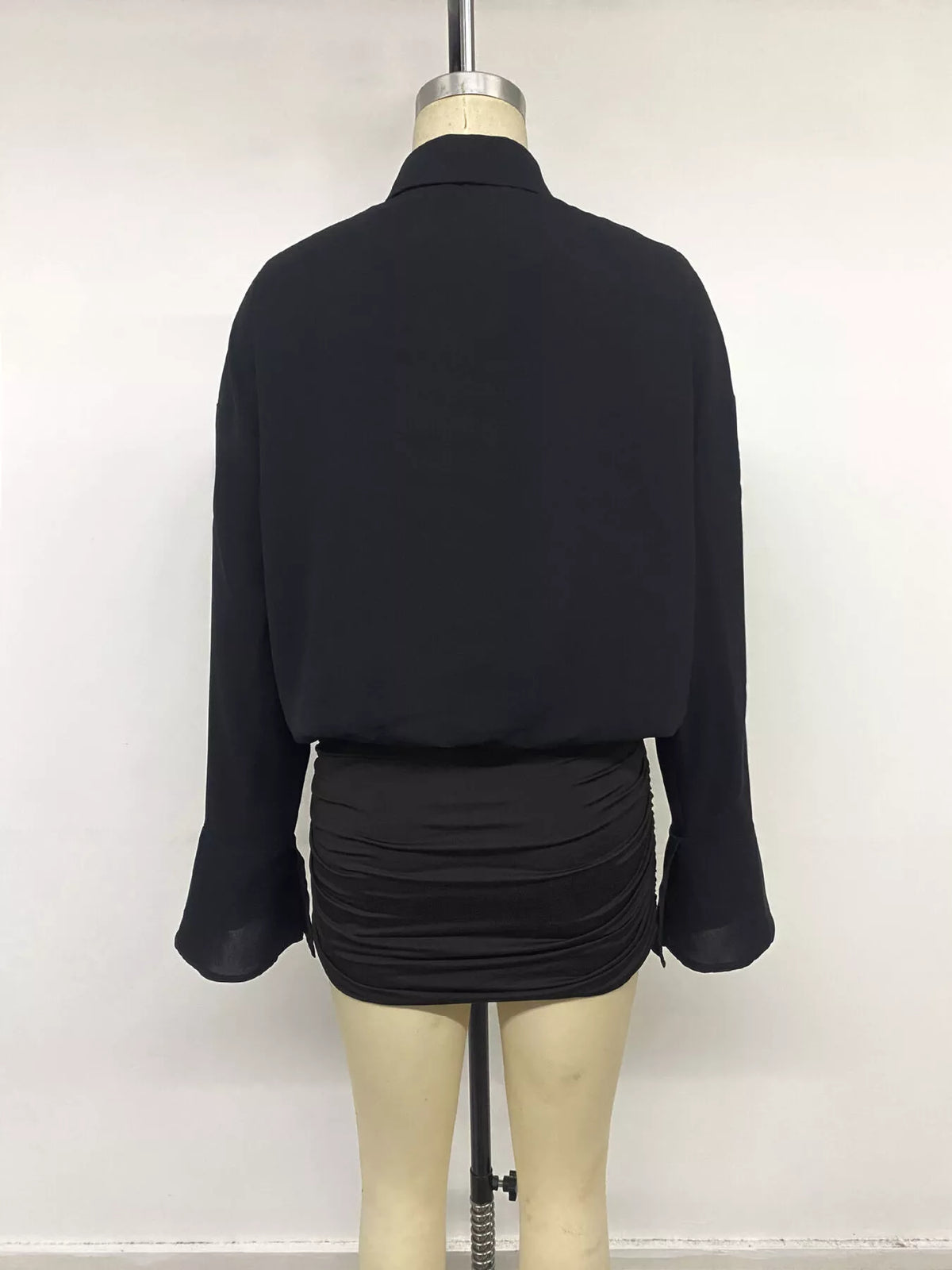 Black ruched bodycon shirt dress with flounce waist, long sleeves