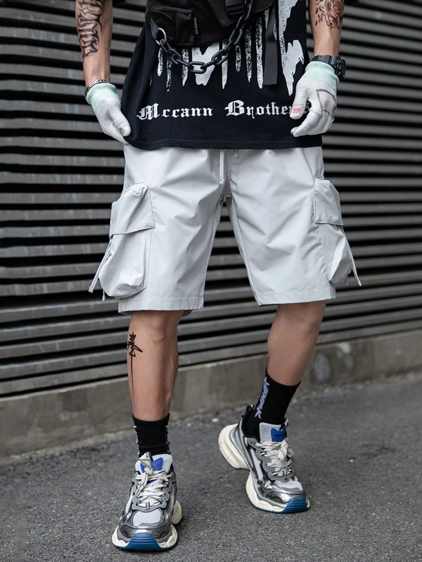 Light grey cargo shorts with side flap pockets and drawstring waist