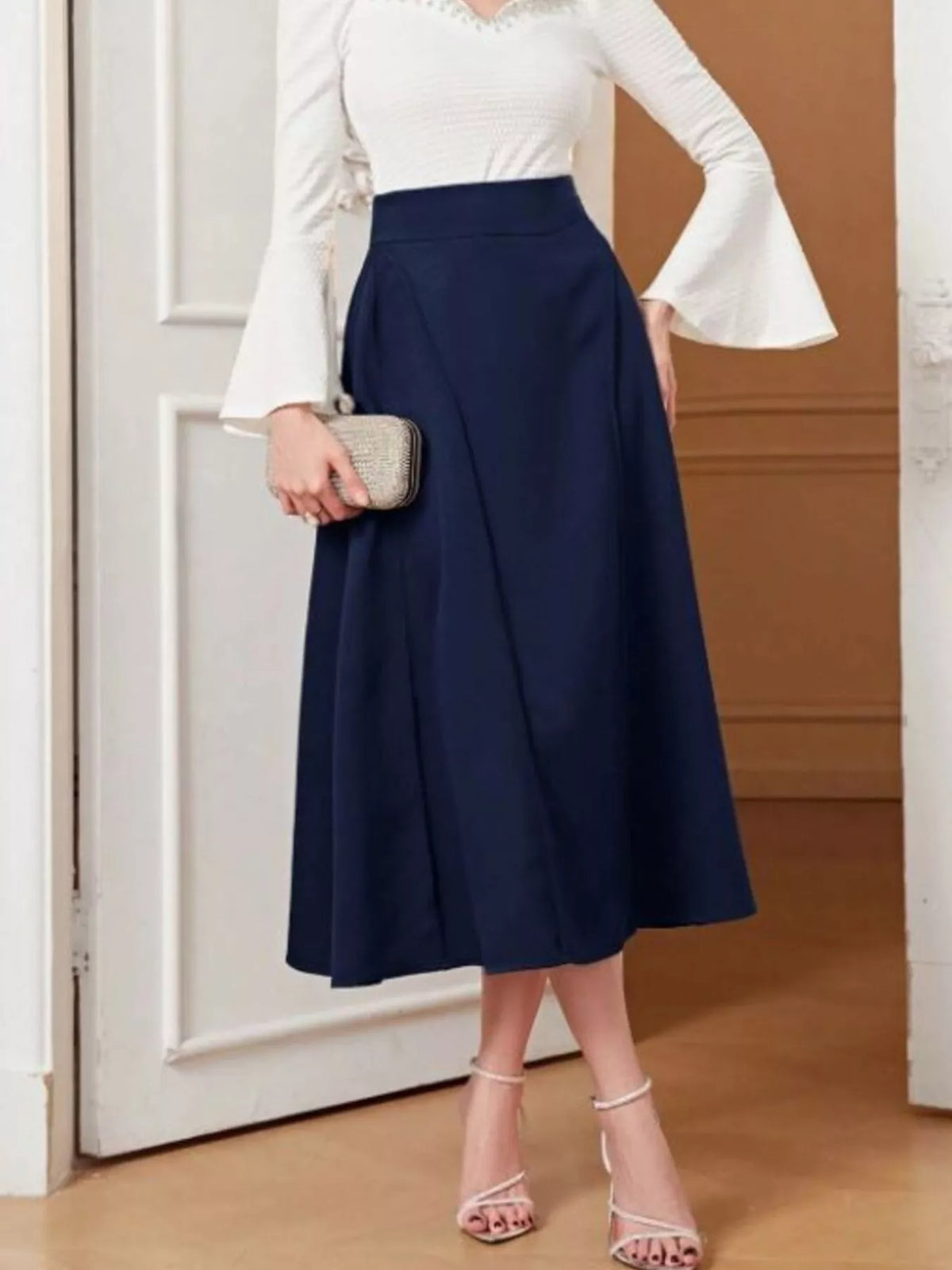 Dark blue A-line midi skirt, side view
