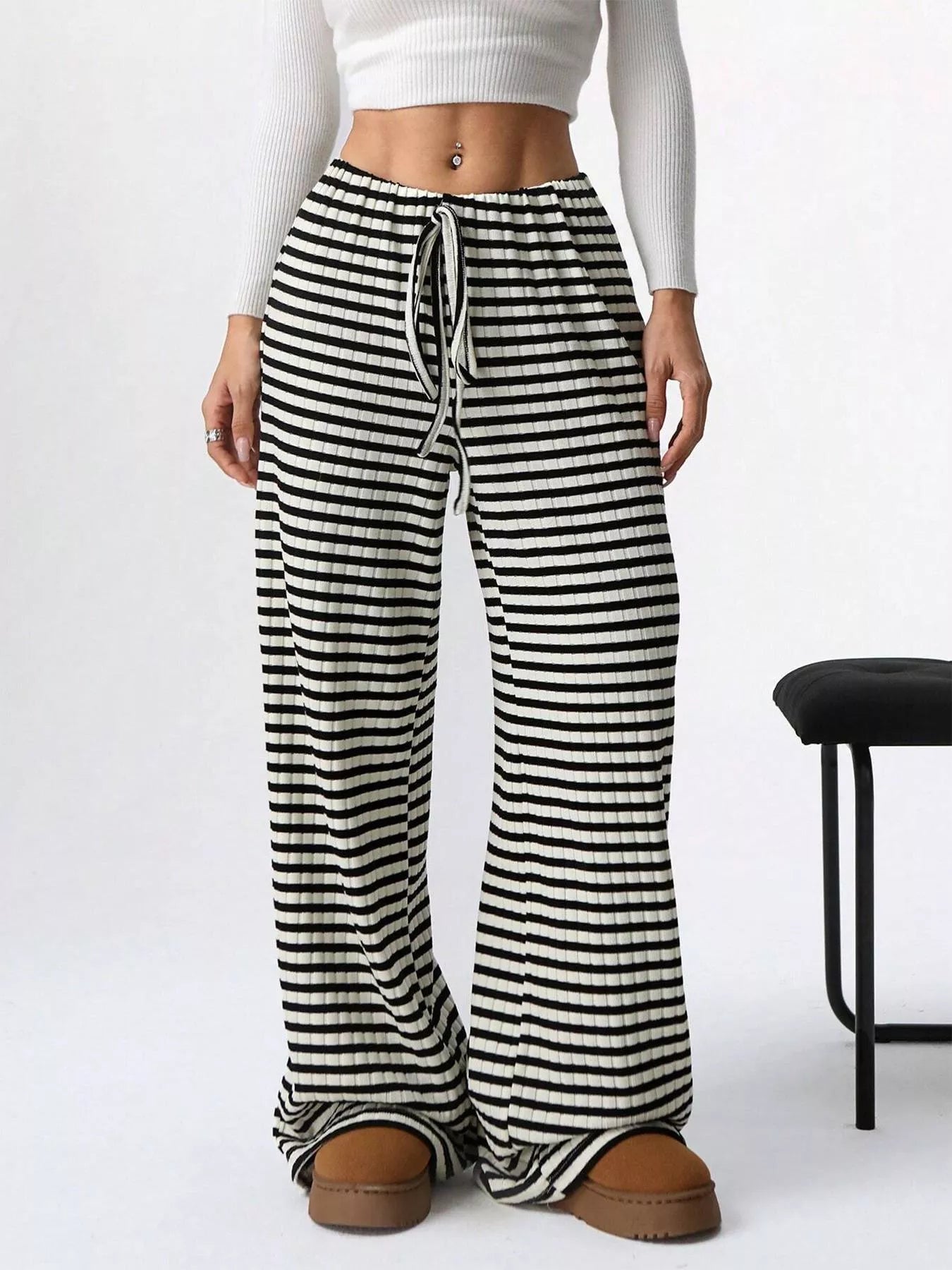 Black-and-white striped wide-leg knit pants with drawstring waist and roomy legs