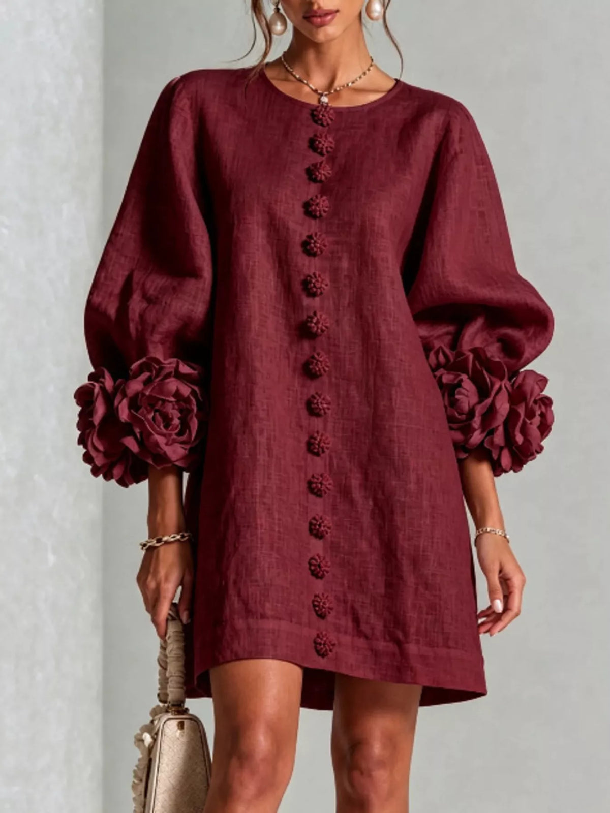 Deep red linen mini dress with 3D floral applique down front and rose puff sleeves