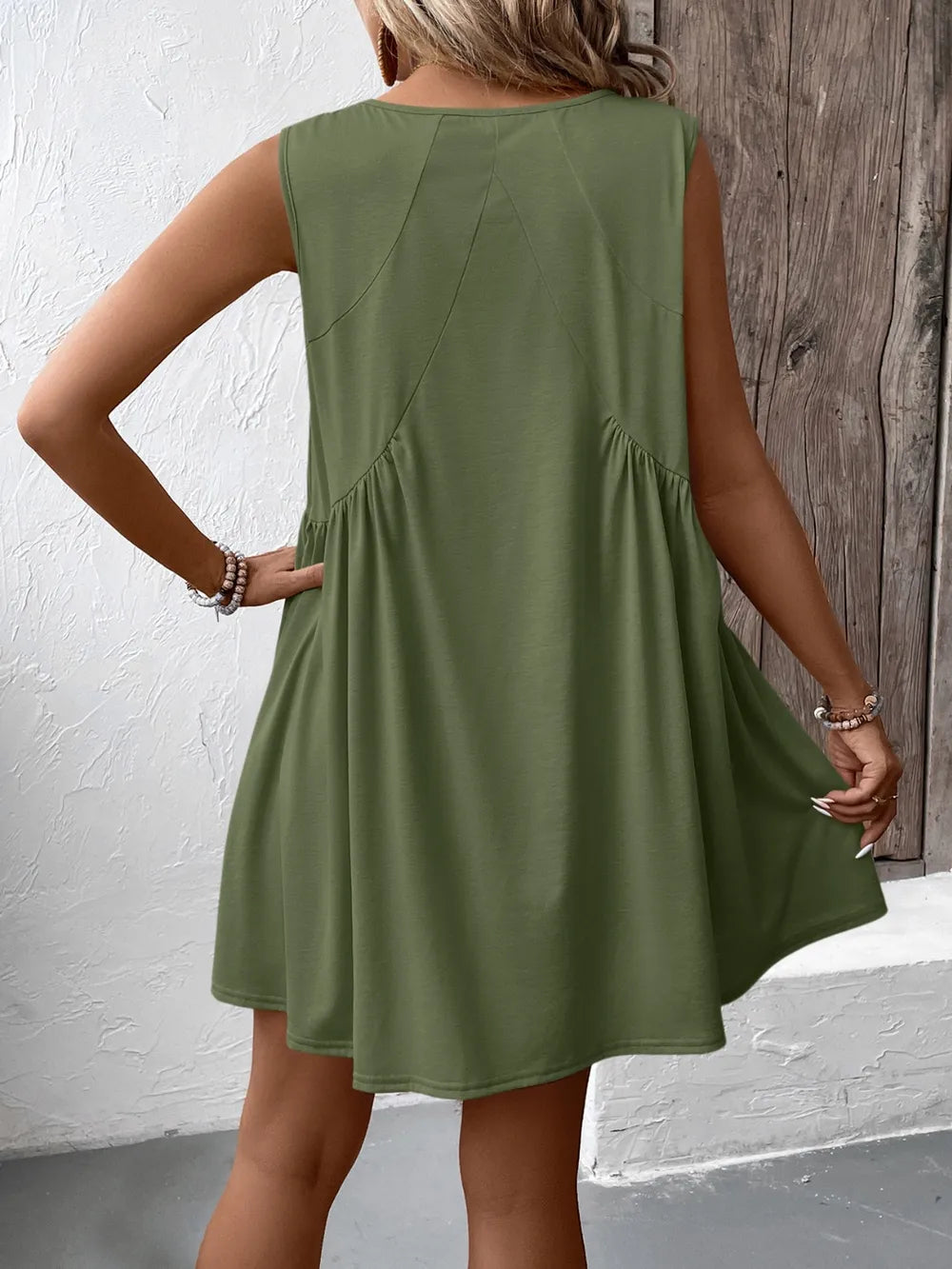 Ivy Lane Ruched V-Neck Sleeveless Mini Dress in olive green, back view.