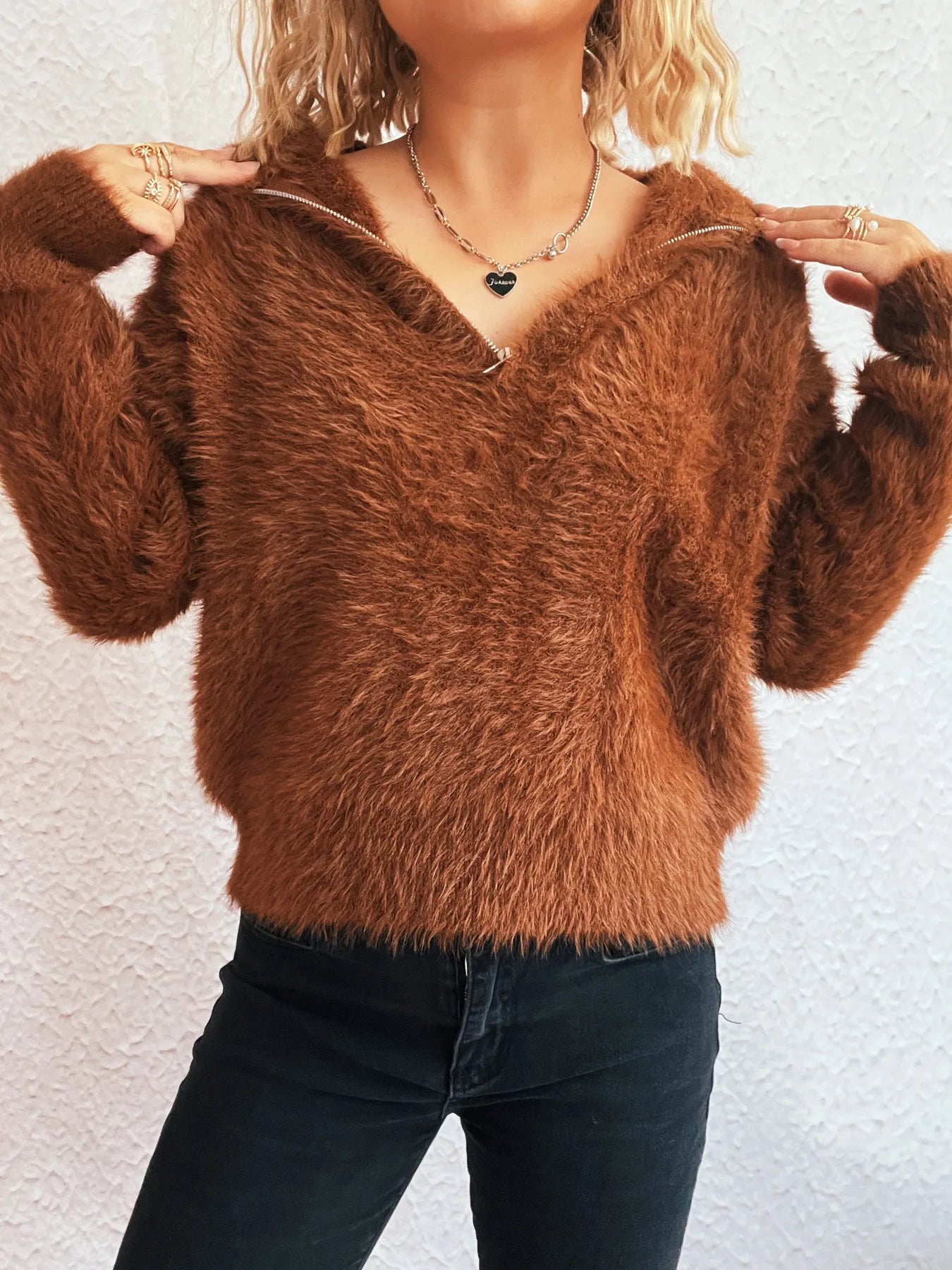 Brown fuzzy half-zip sweater with long sleeves and half-front zipper