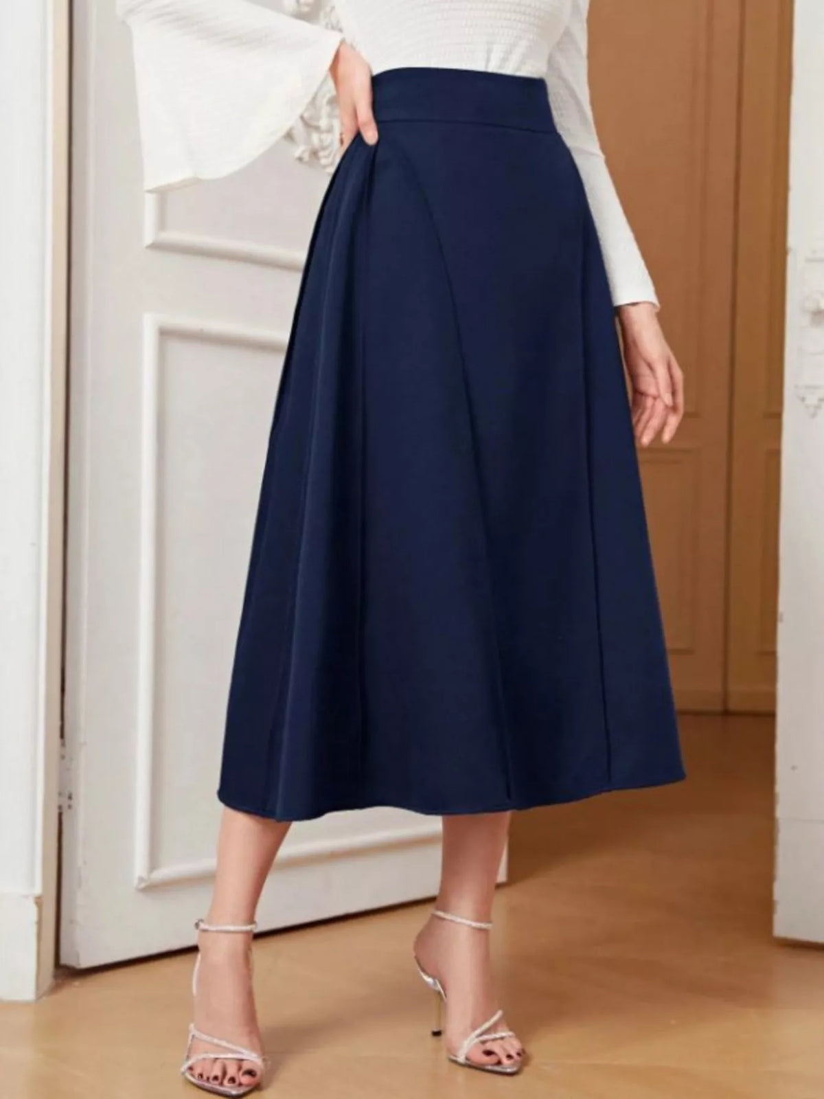 Dark blue A-line midi skirt, front view