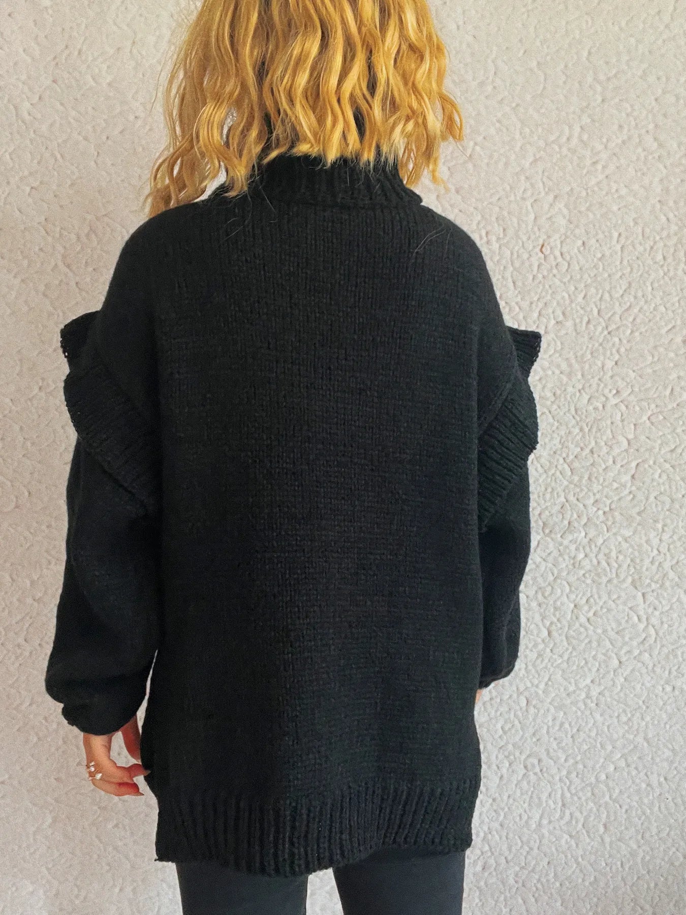 Ruffled turtleneck knit sweater, black, back view with ribbed hem and cuffs