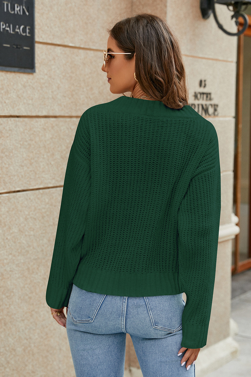Green openwork knit surplice sweater with long sleeves in back view