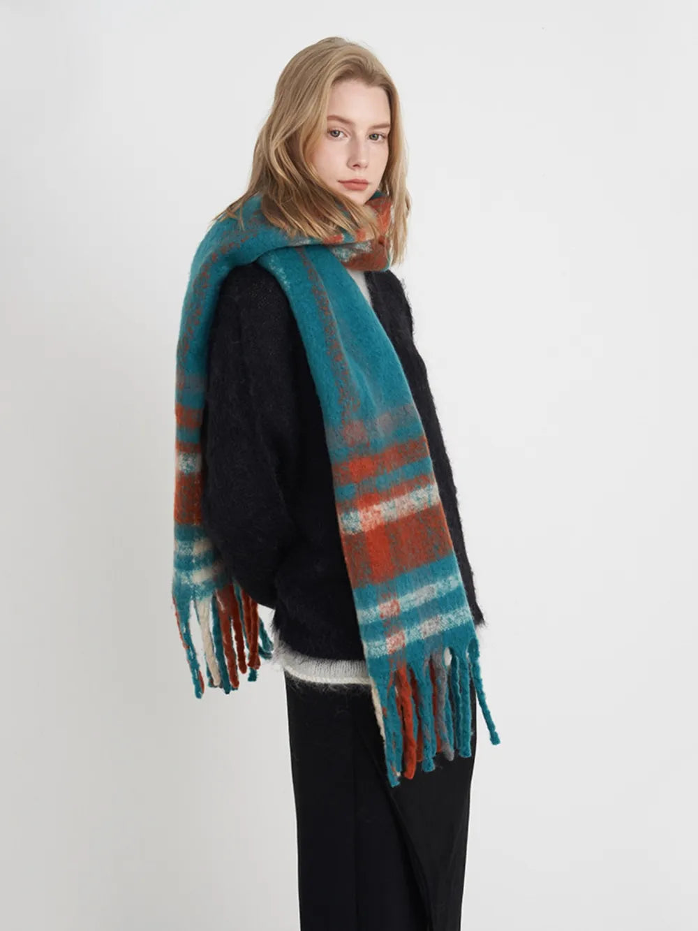 Plaid polyester scarf in teal and multi-color stripes with long fringe.