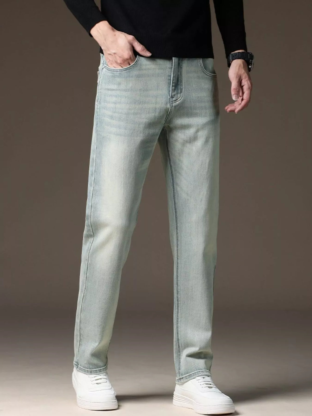 Light wash straight-leg jeans shown from the side with belt loops
