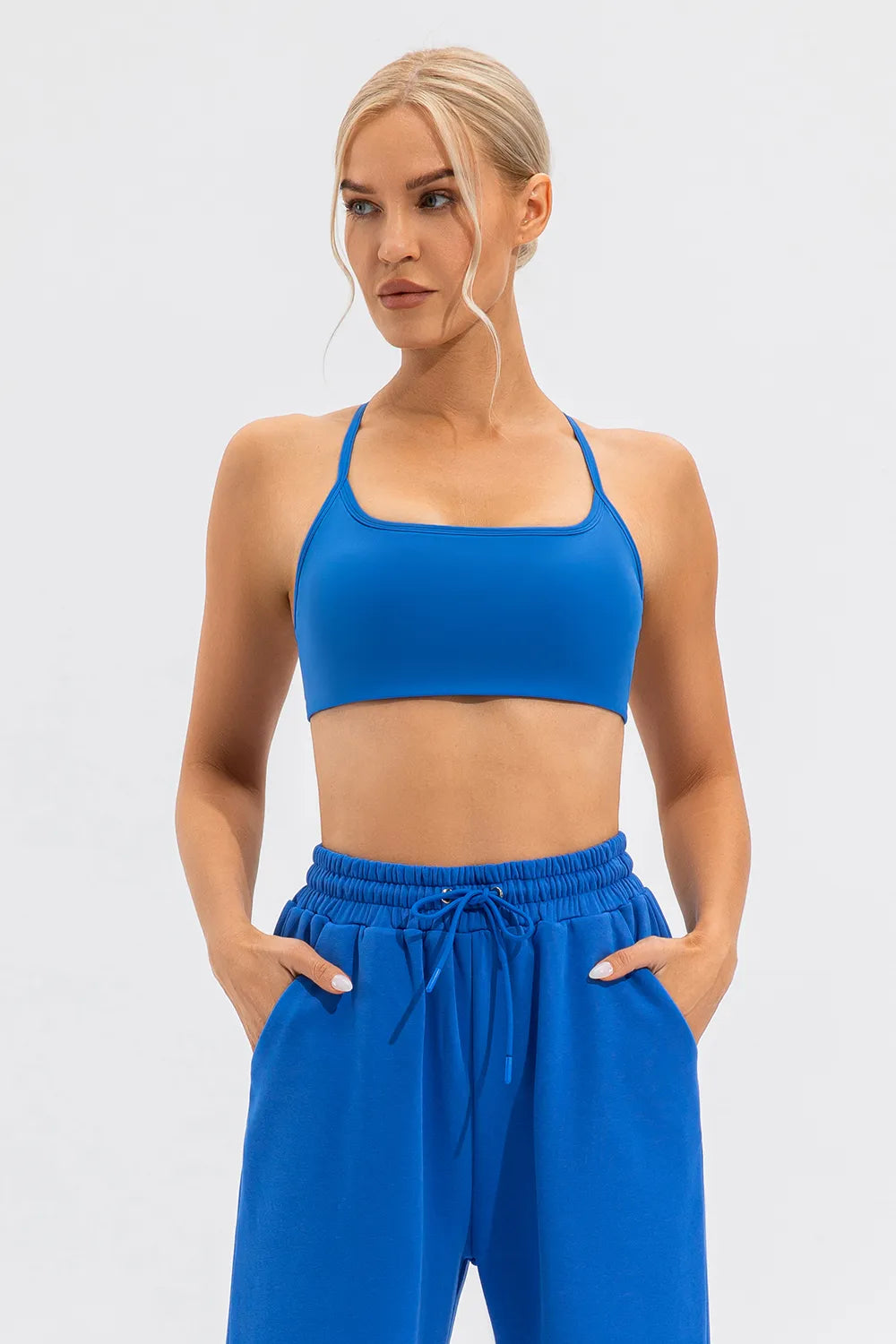 Blue active cami with thin spaghetti straps and smooth cropped bust