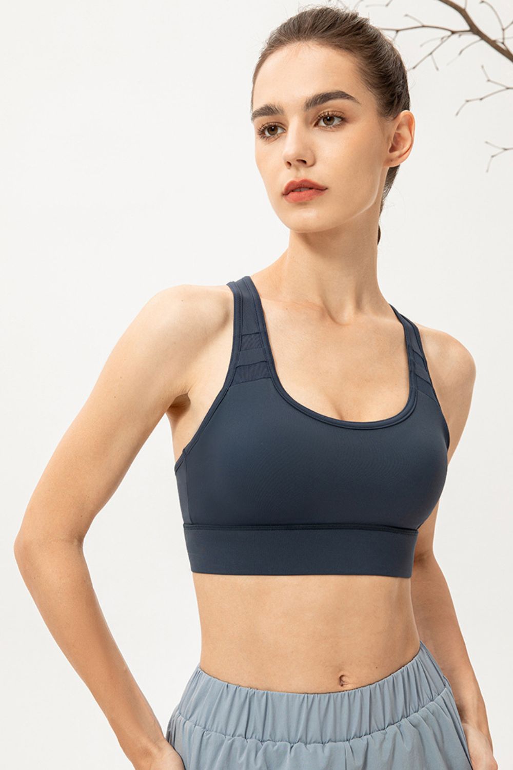Long sports bra, scoop neck, deep teal racerback with wide bottom band