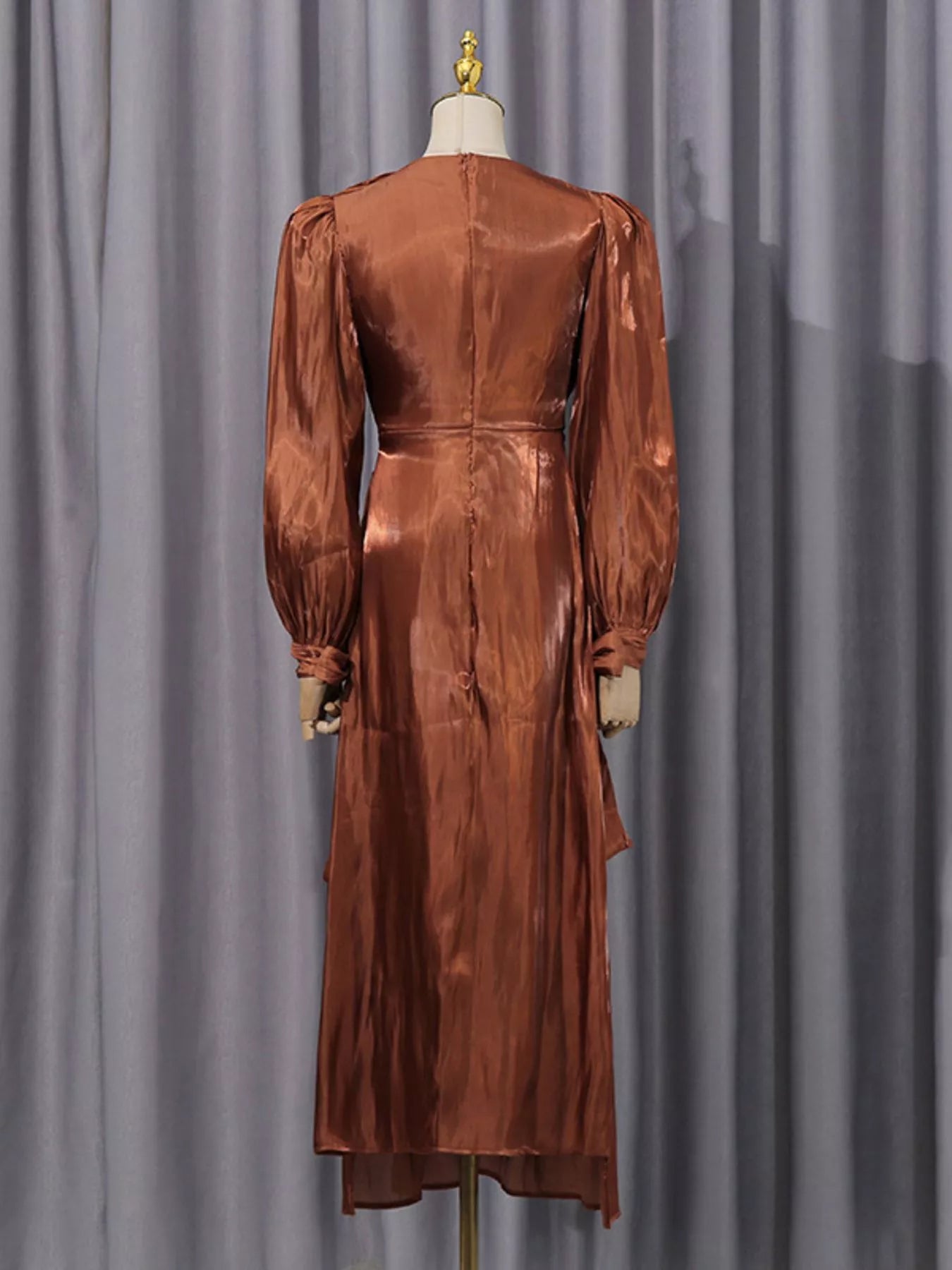 Cedar & Moore Front Twisted Draped Long Sleeve Maxi Dress in copper satin, back view.