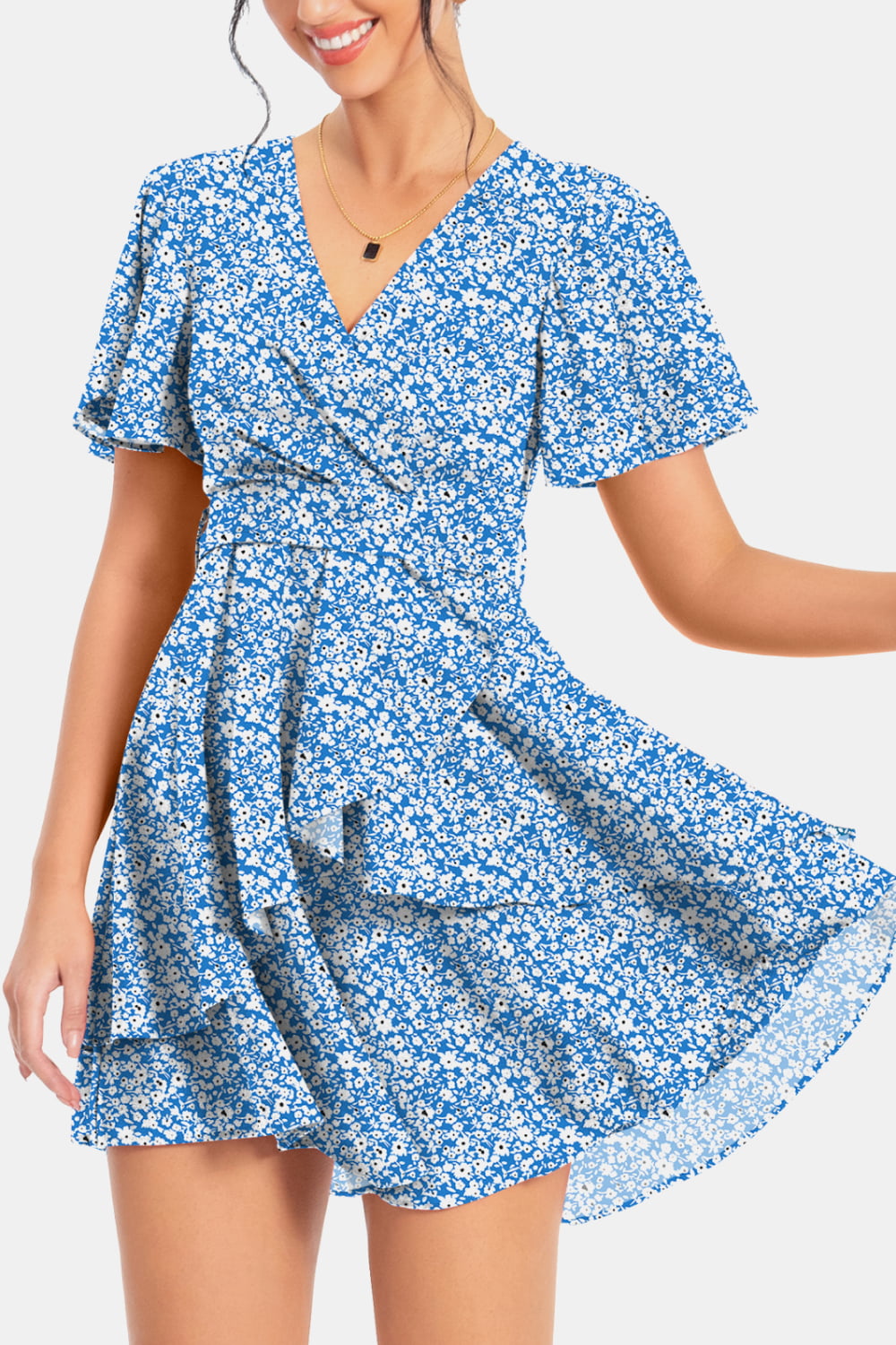 Blue floral surplice mini dress with flutter sleeves and flared tiered hem