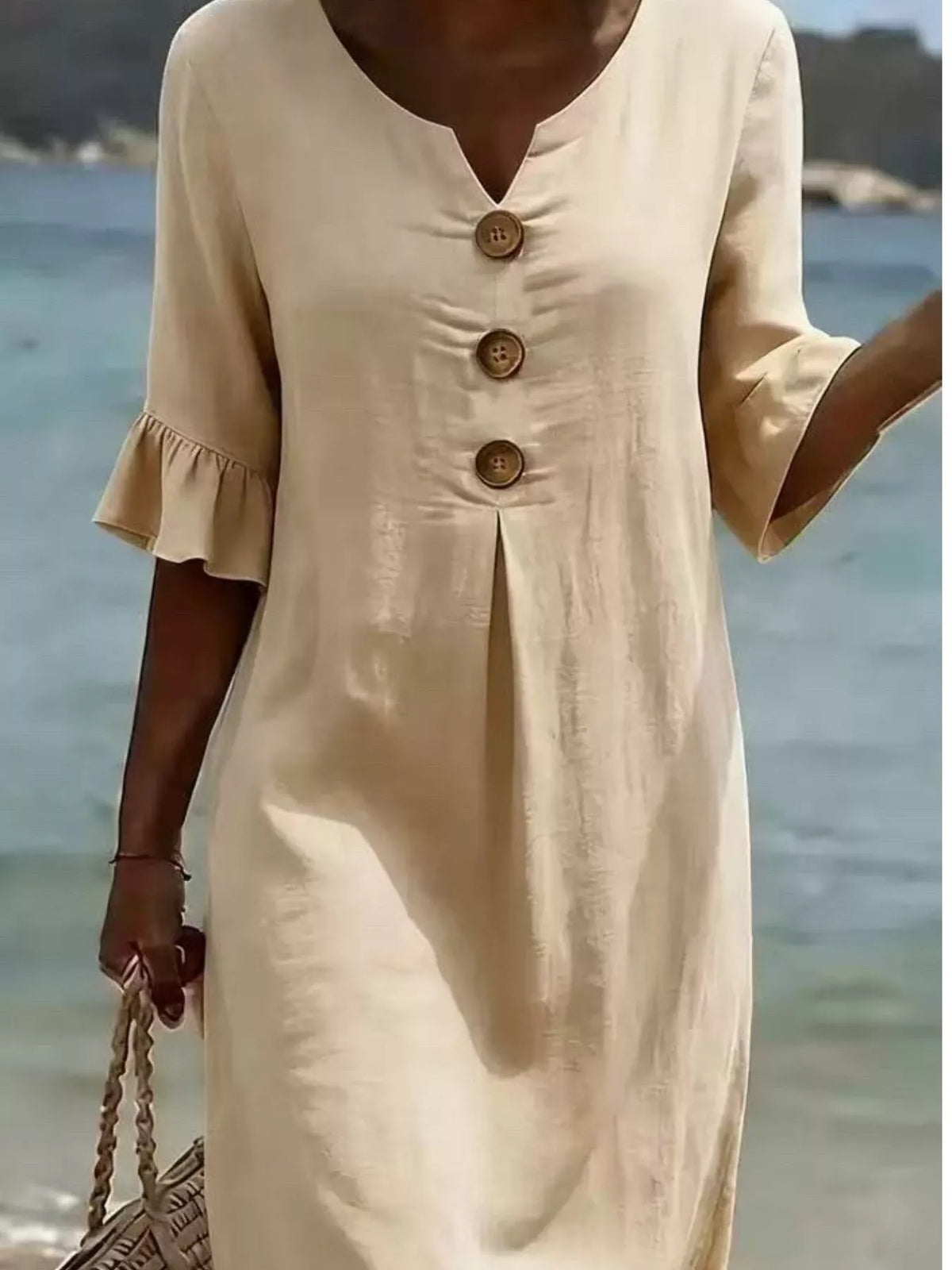 White button-front ruffle half-sleeve dress with V-neck and three-button placket