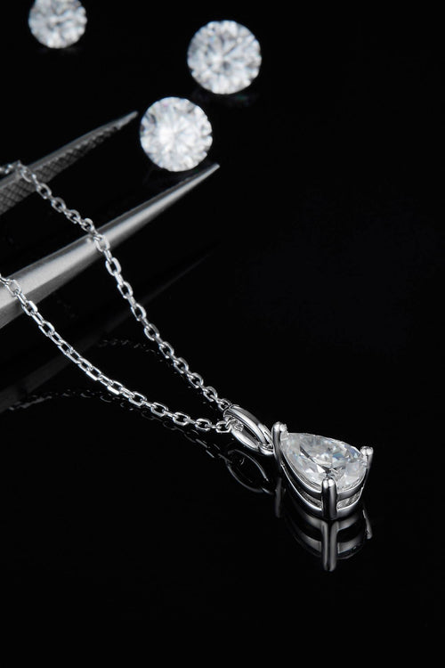 Sterling silver necklace with teardrop moissanite pendant in prong setting and chain links