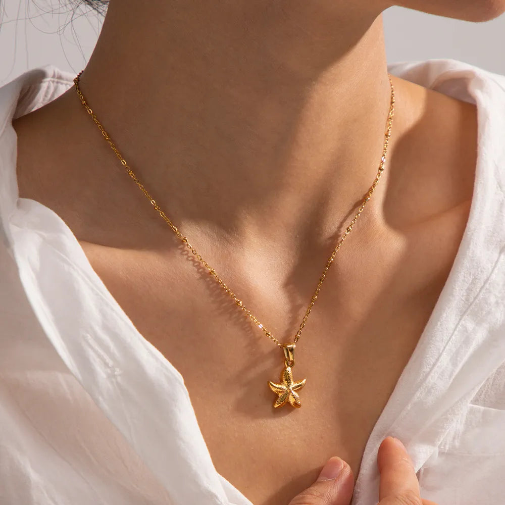 Gold-plated starfish pendant necklace with fine chain and small starfish charm