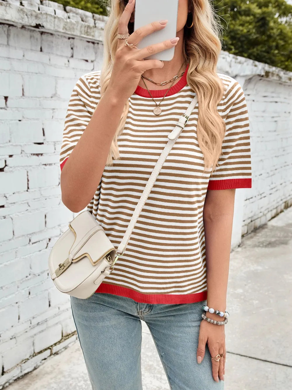 Beige-and-brown striped knit top with red contrast crew neck and ribbed cuffs