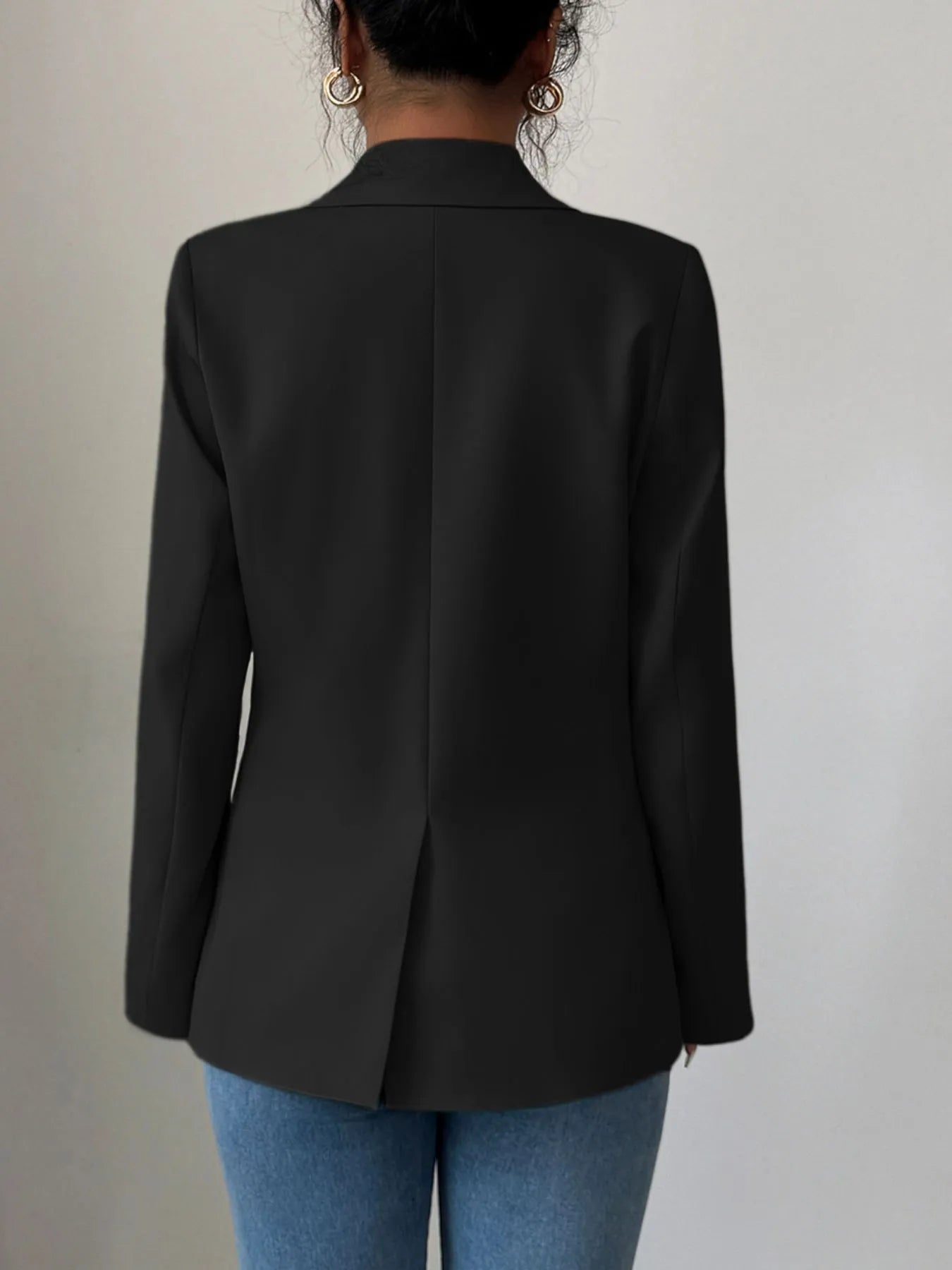Black one-button lapel blazer back view with central seam