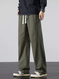 Mens army green wide-leg casual pants with elastic waist and white drawstring ties