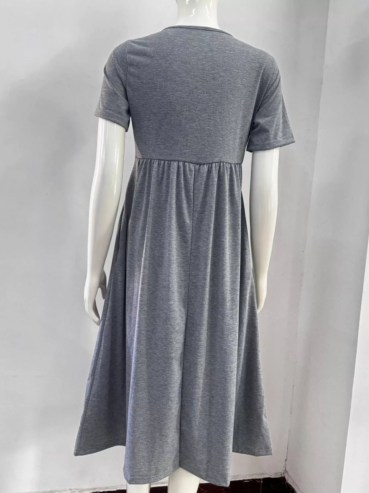 Gray crisscross high-waist midi dress back view with short sleeves and gathered skirt