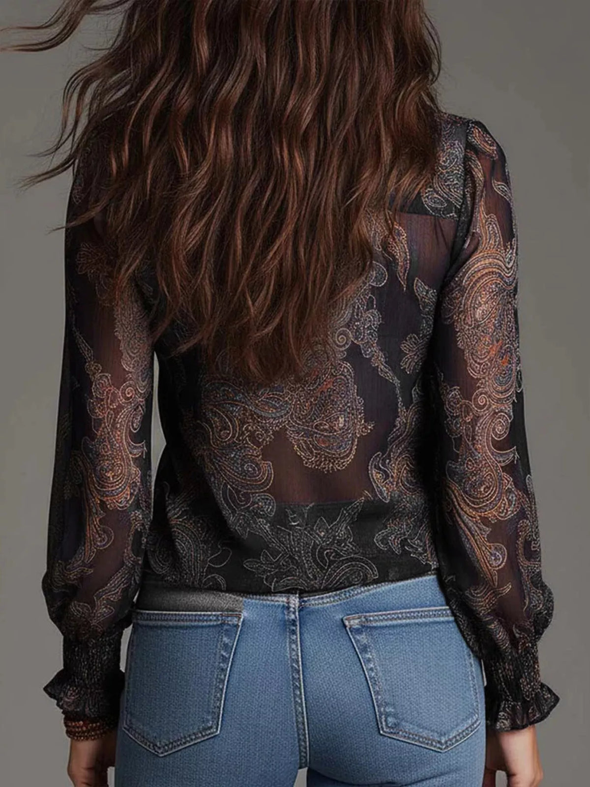 Black paisley ruffle zip-front blouse with long sleeves, back view
