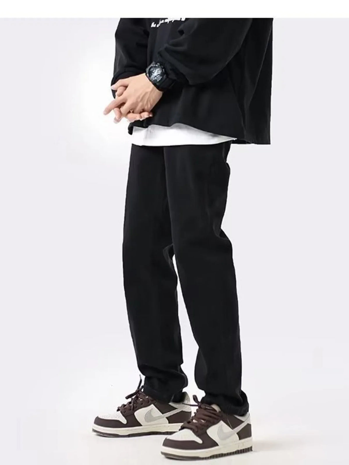 Black slim-fit cotton stretch jeans with relaxed waistline and tapered pant legs