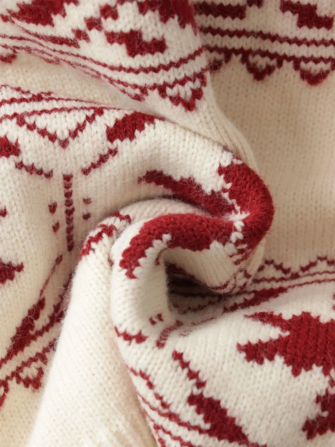Round-neck sweater in white with red snowflake pattern knit, rolled sleeve detail