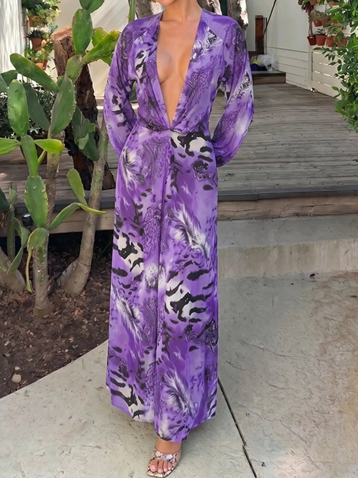 Purple printed flowy maxi dress with deep V neckline and long sleeves