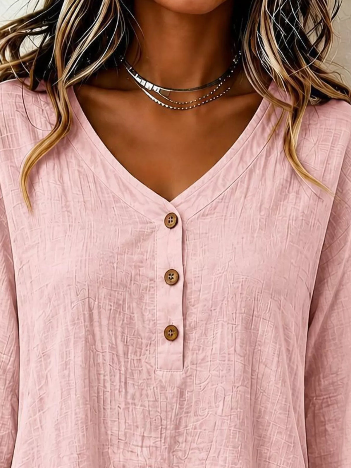 Pink V-neck button-front long-sleeve blouse with wood-look buttons