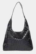 Woven faux leather tote bag with soft top handles, dark woven texture