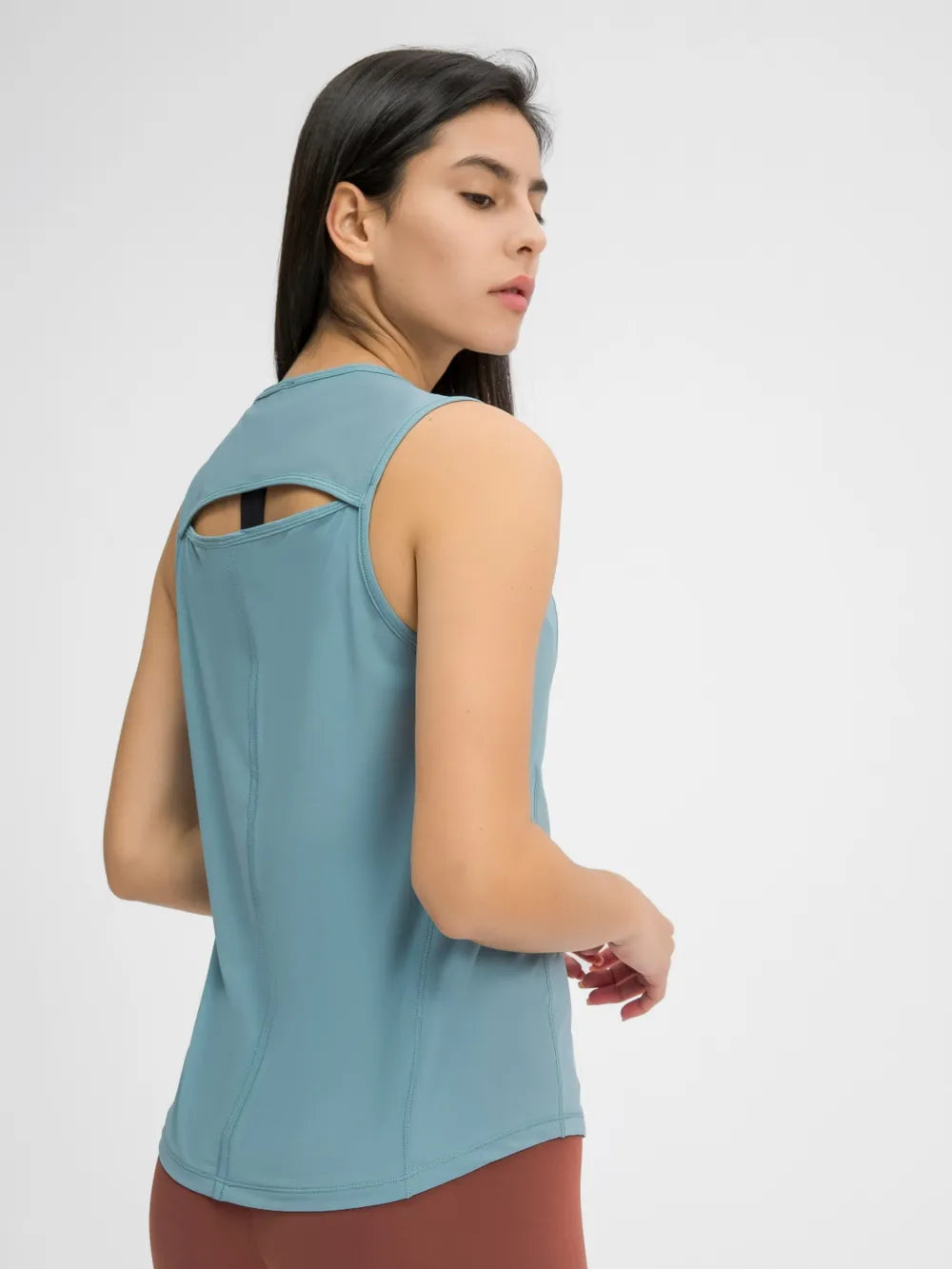 Teal active tank top back view with shoulder cutout detail