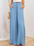 Light blue wide-leg pants with elastic waistband, drawstring, and side pockets