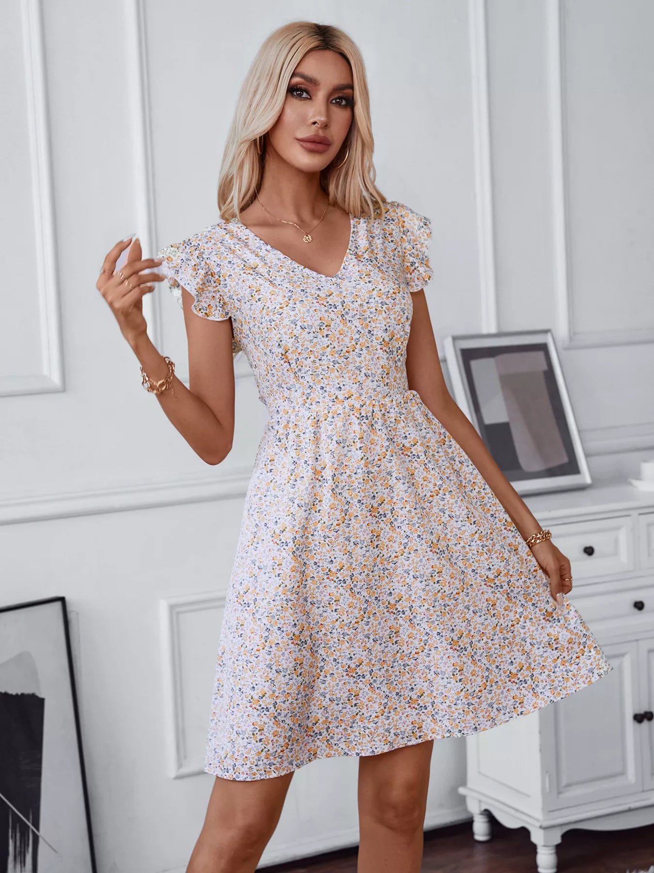 Floral print mini dress with lace-trim V-neck and short puff sleeves, white base