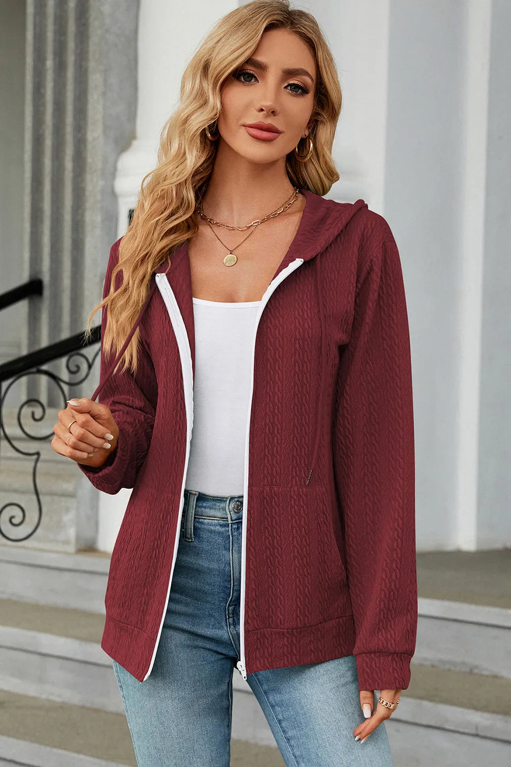 Burgundy drawstring zip-up hoodie with hooded neckline and white-trim front zipper