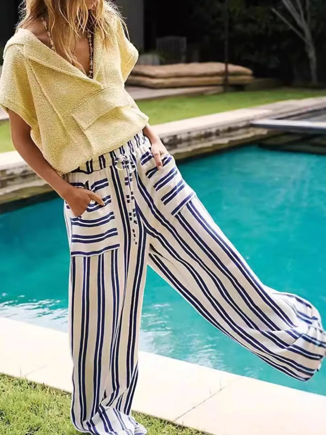 Wide-leg drawstring pants with navy-and-white vertical stripe pattern