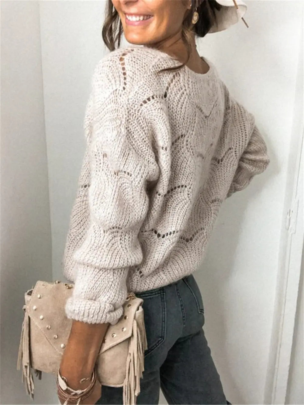Beige openwork button-up cardigan, long sleeves with textured knit eyelet detail.