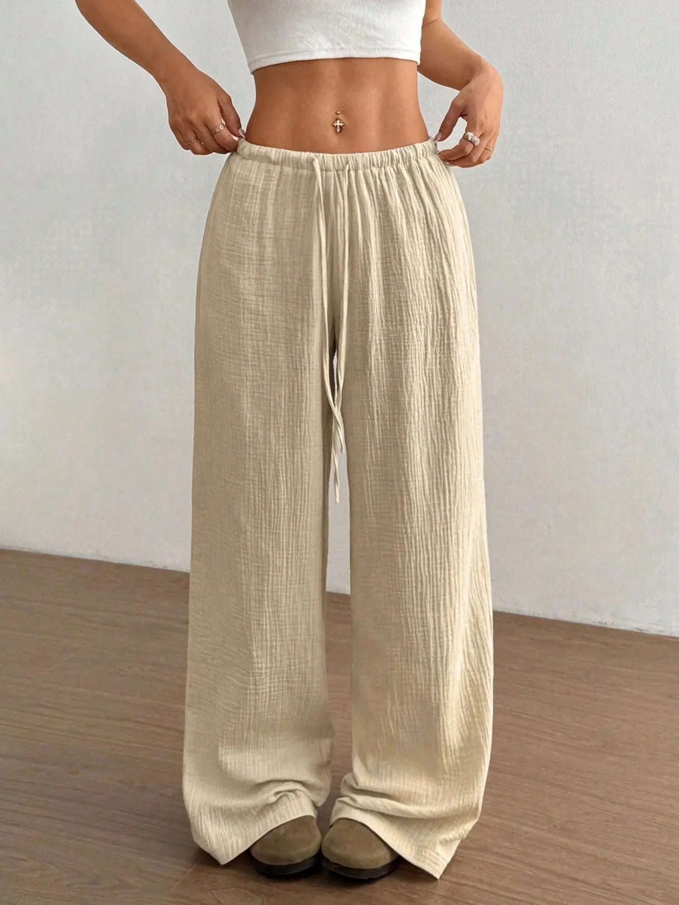 Cream drawstring wide-leg casual pants with elastic waistband and draped wide legs