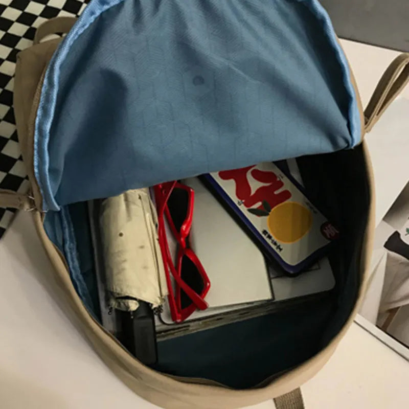 Cotton zip backpack open showing interior organizer and lining