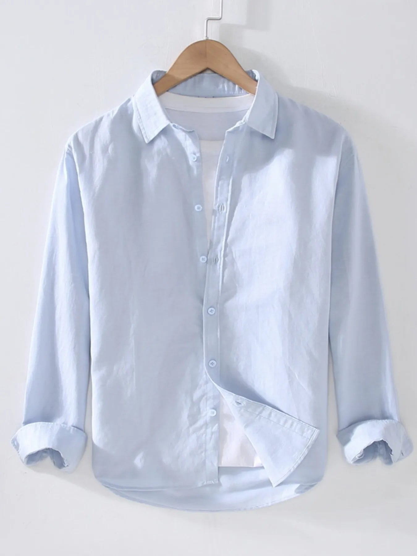 Light blue short-sleeve button-up shirt with point collar and front button placket