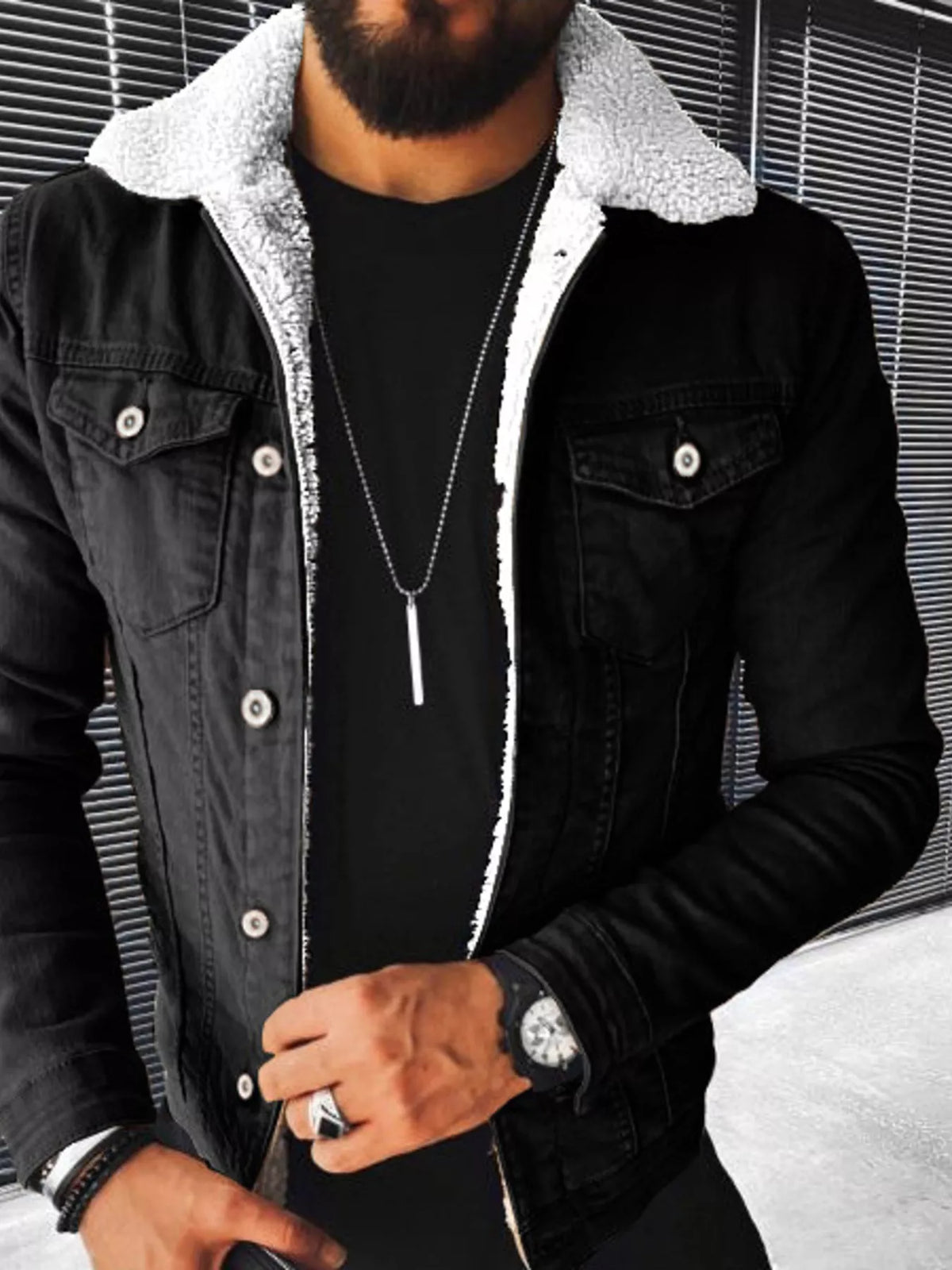 Black denim jacket with sherpa lining, button front and two chest pockets