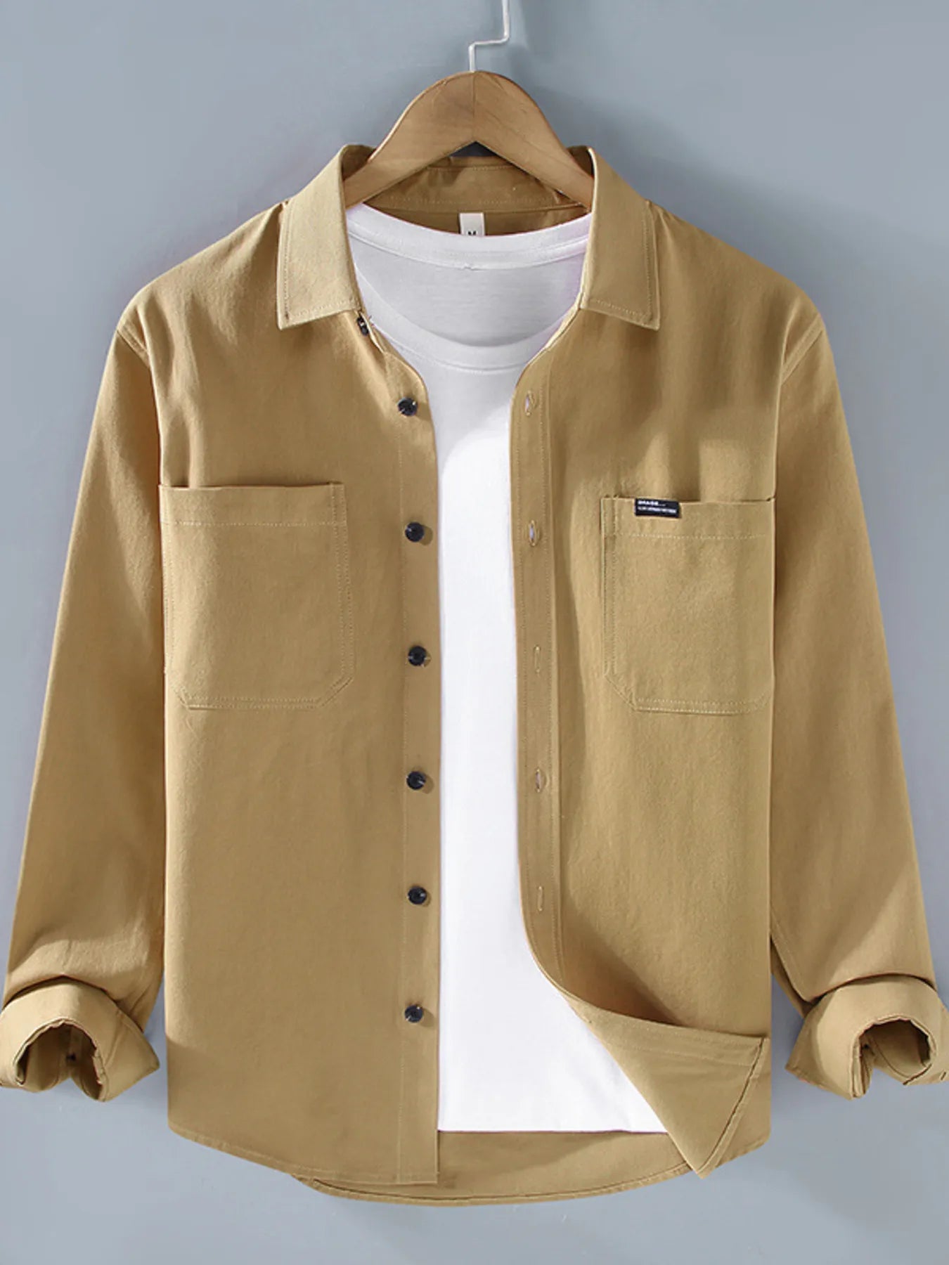Khaki long sleeve button-up shirt with chest pockets and button front