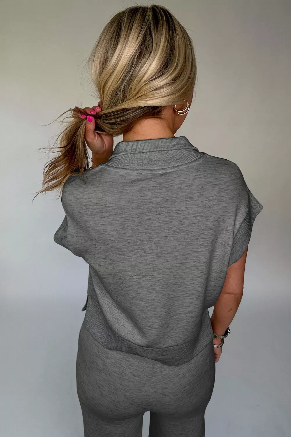 Dark gray polo tee and pants set from back, short sleeves and wide-leg fit.