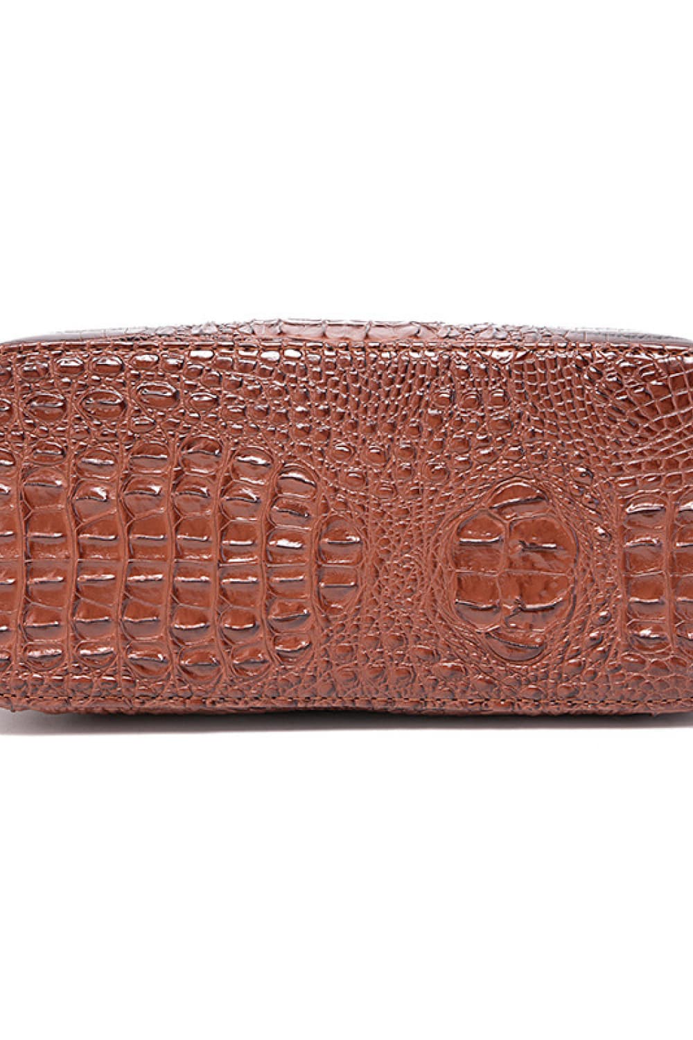 Dark brown croc-embossed vegan leather handbag side panel with embossed patterns
