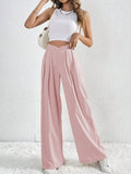 Dusty pink wide-leg pants with ruched front and V-waist detail