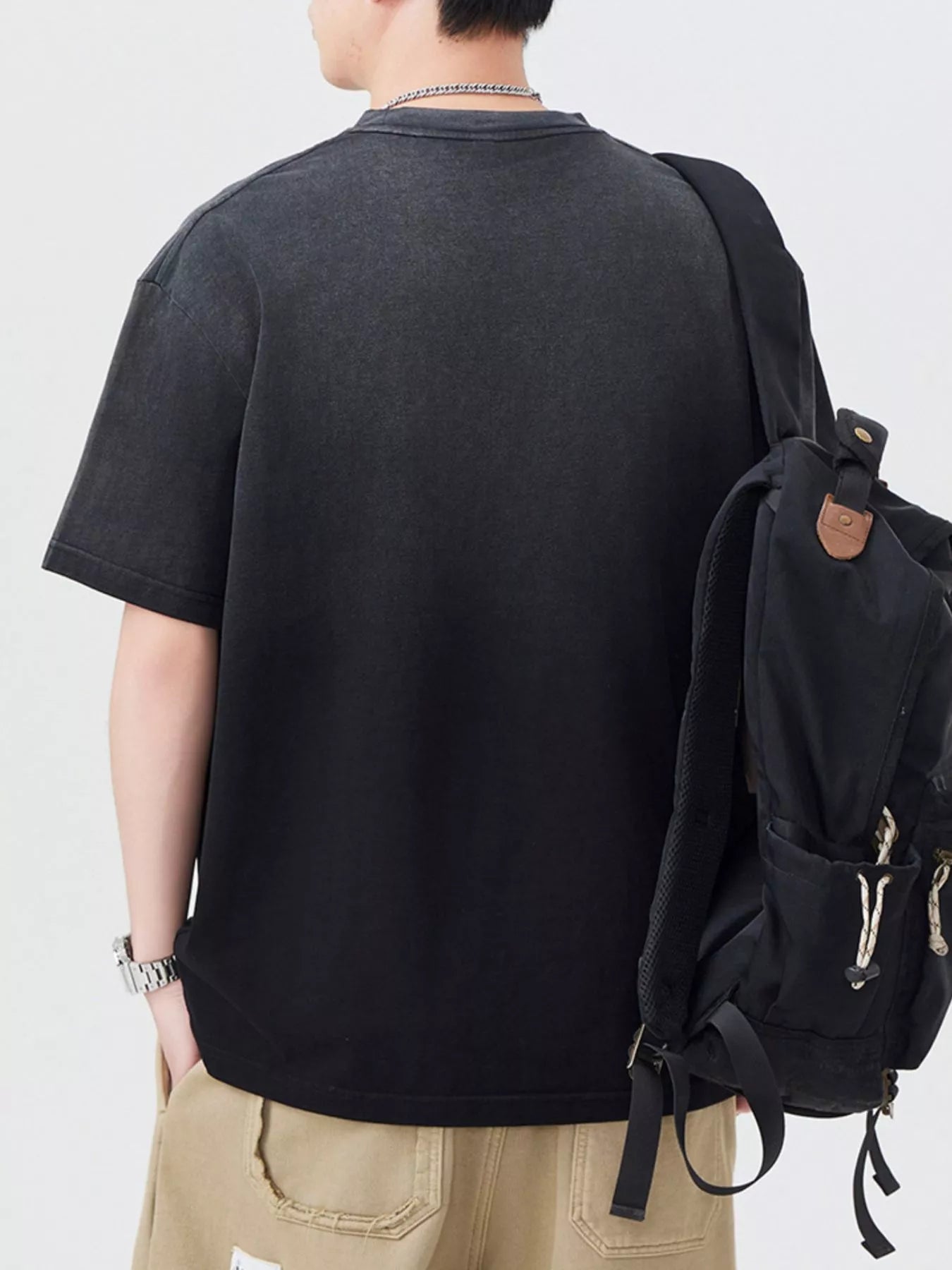 Black crewneck short-sleeve T-shirt, back view