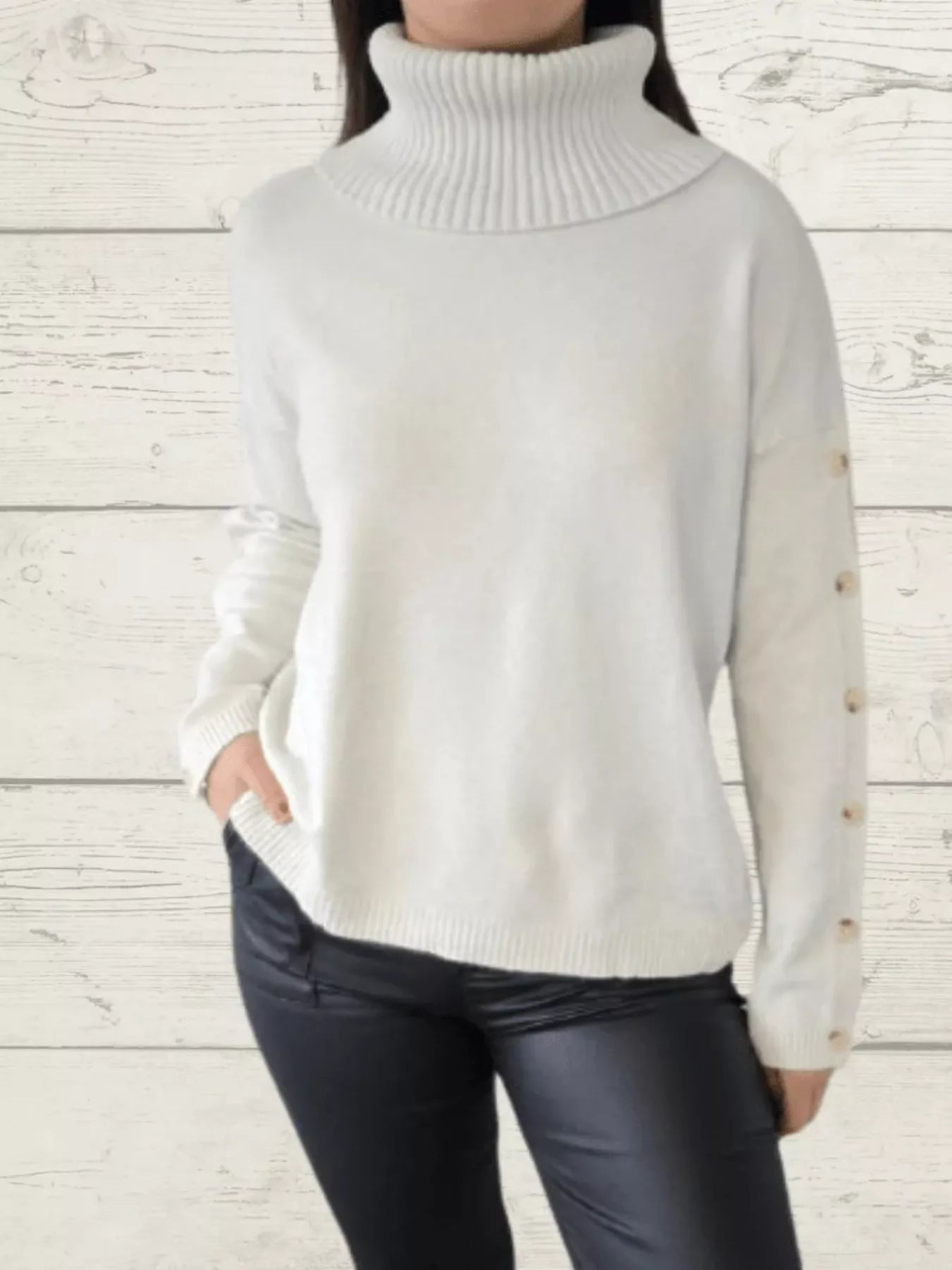 White knit turtleneck long sleeve sweater with ribbed collar and cuffs