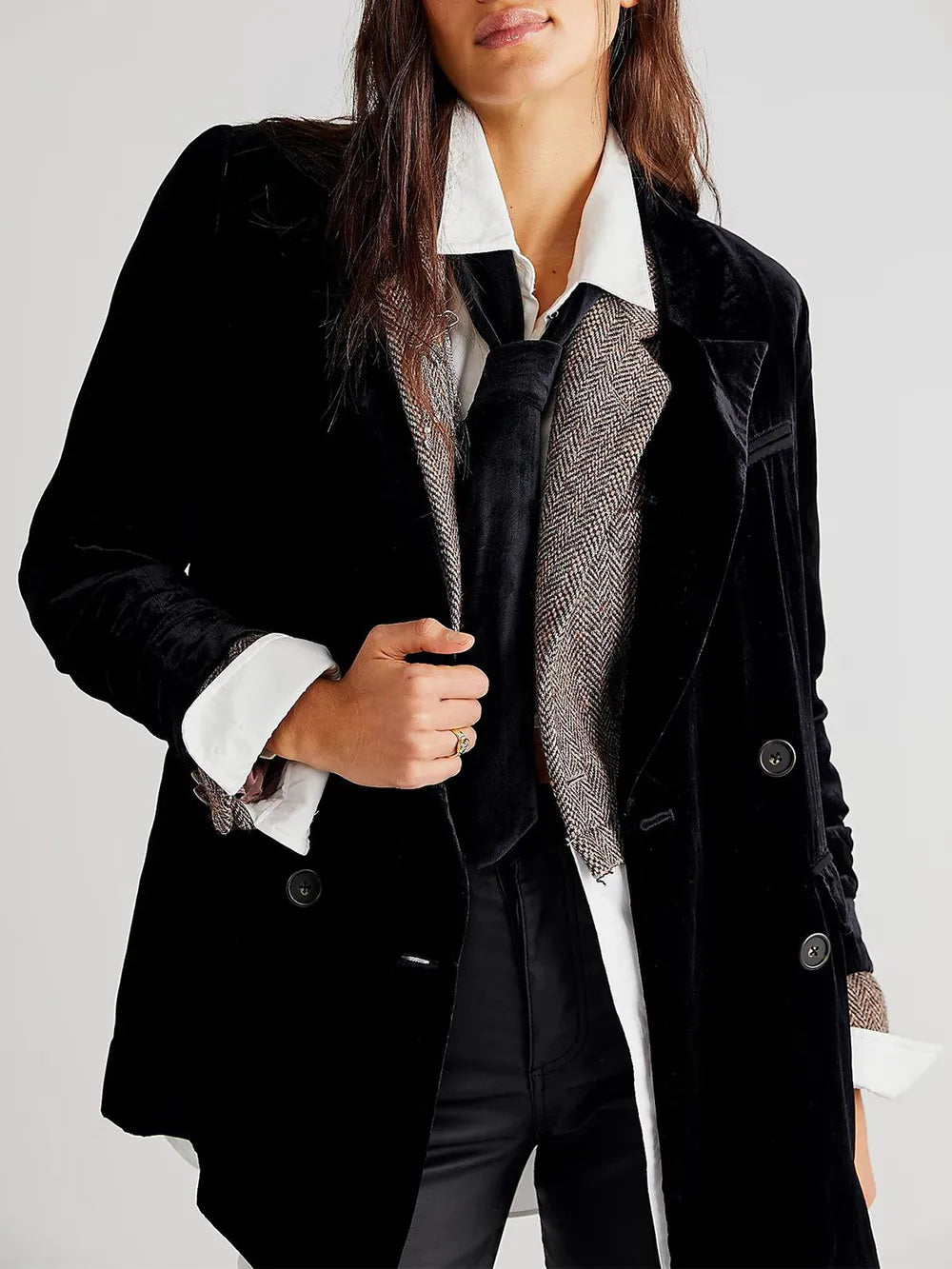 Black corduroy blazer close-up with notch lapel, button front, and chest pocket