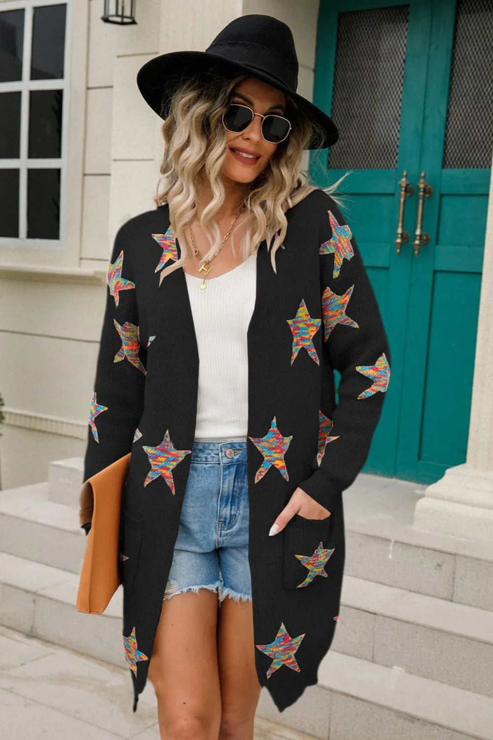 Black open-front cardigan with colorful star patch print, long sleeves