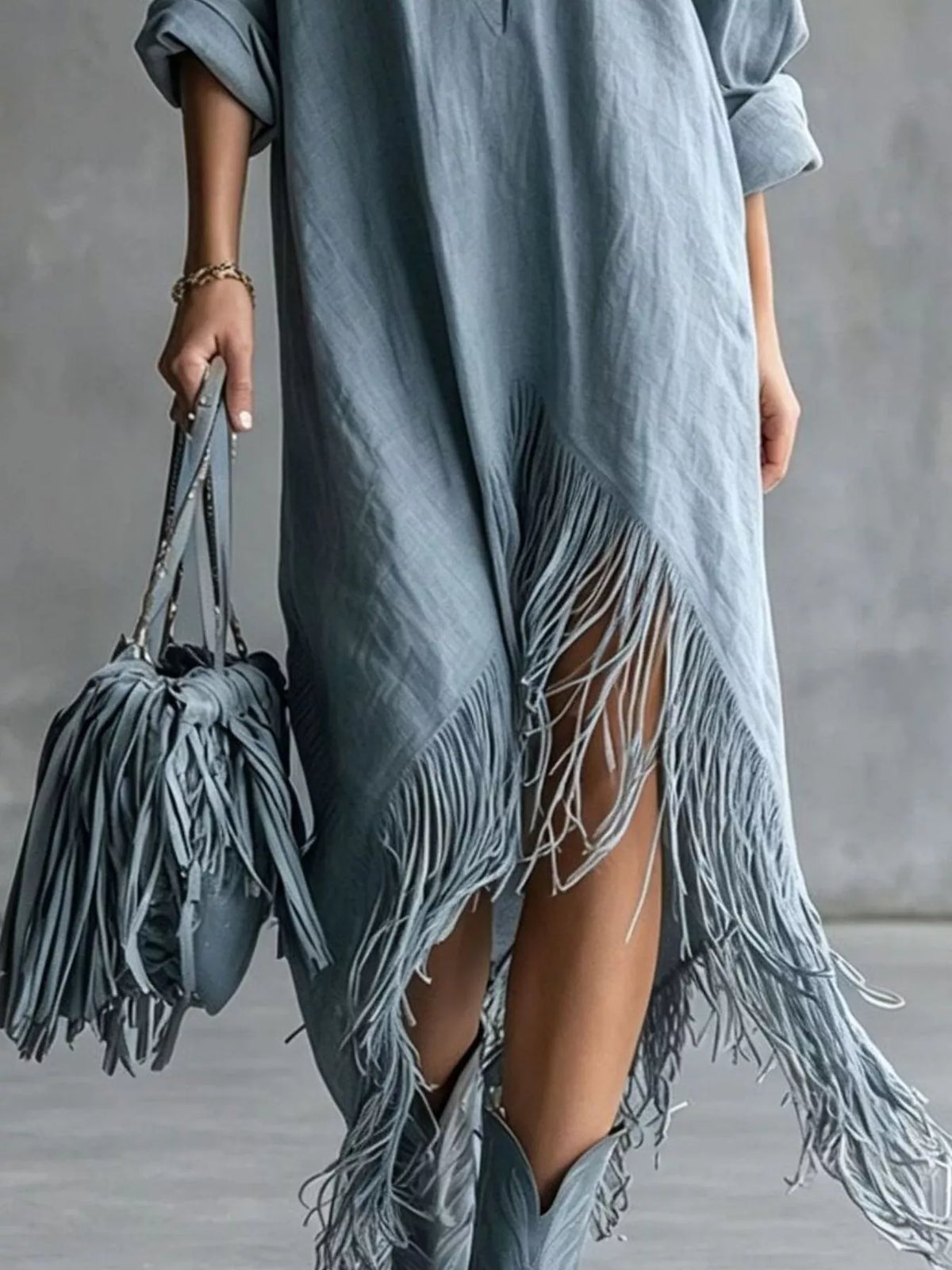 Dusty blue midi dress hem detail with layered tassel fringe