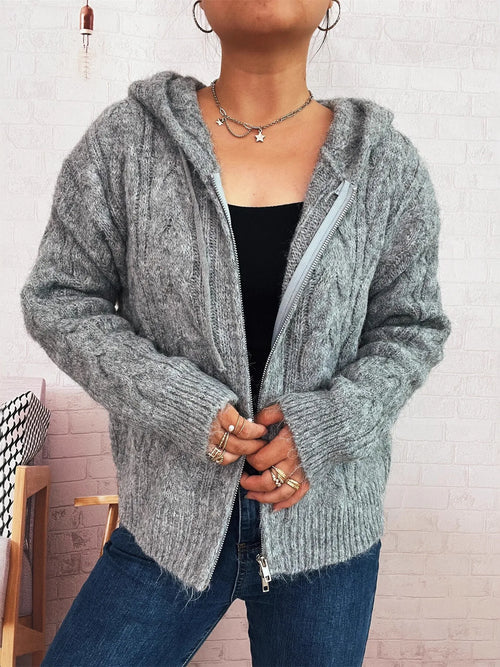 Gray cable knit hooded zip-up cardigan with long sleeves and ribbed hem and cuffs.