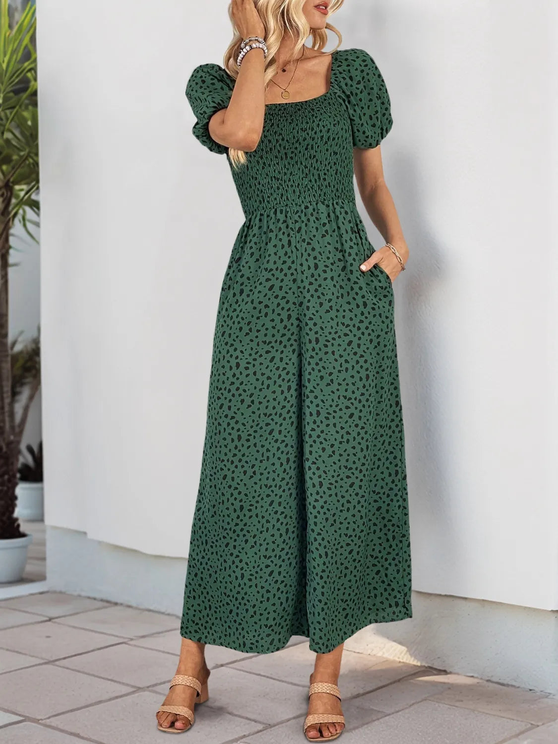 Dark green speckle printed square-neck puff-sleeve jumpsuit, relaxed wide-leg silhouette